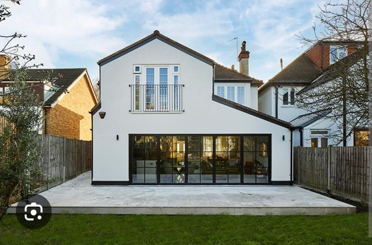 Two-storey rear extension, full-height glazing and Juliet balcony. Rochford, Essex