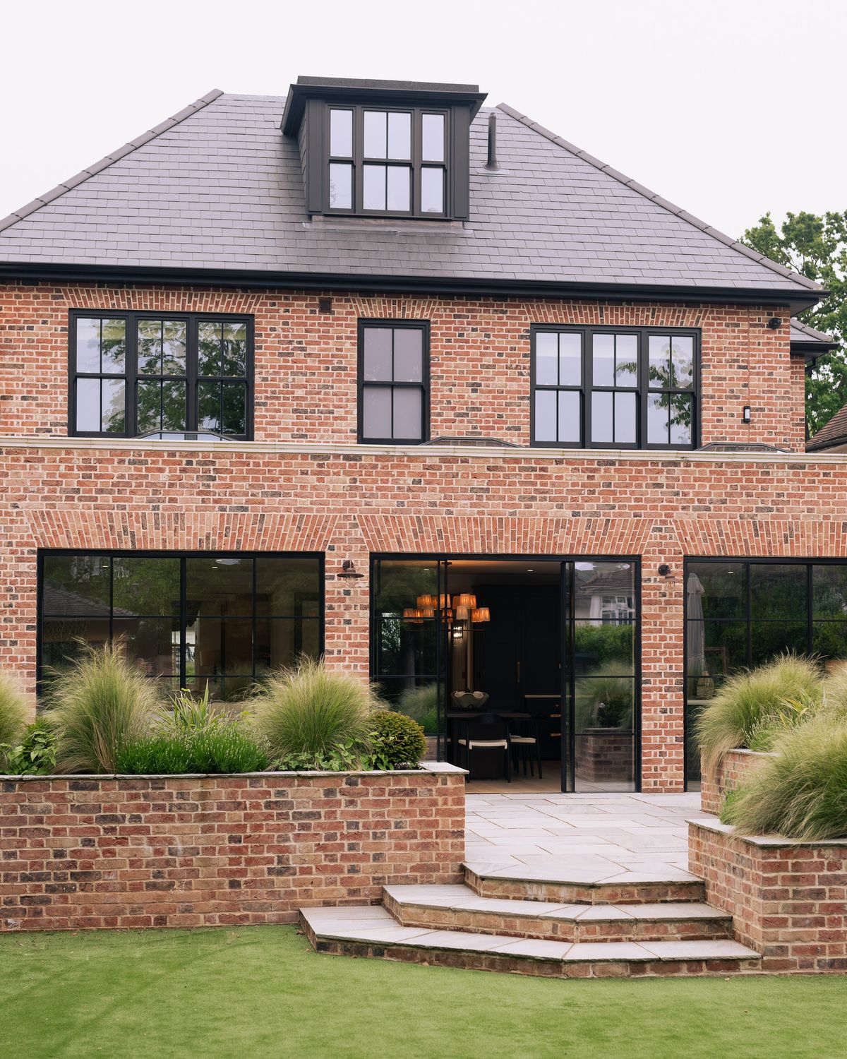 Rear extension in matching brick, full-height glazing. Stock, Essex